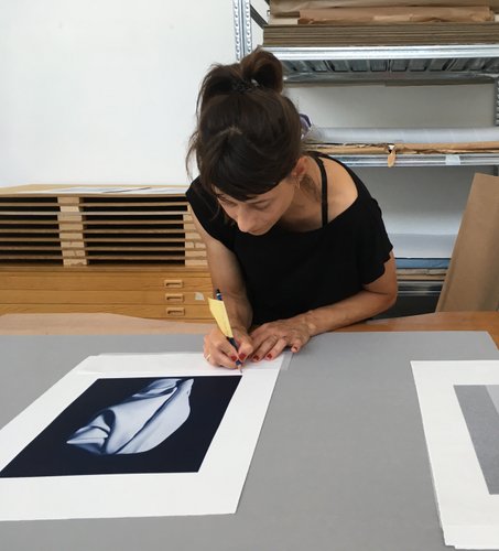 Valérie Collart signing a photogravure project at Printer's Proof