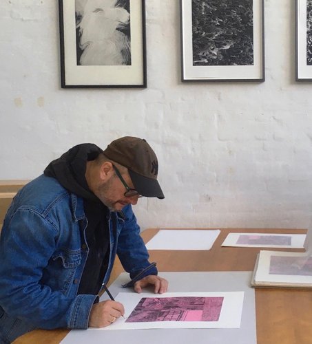 Morten Schelde signing his etching and spit bite aquatint 'Ocean of Time'